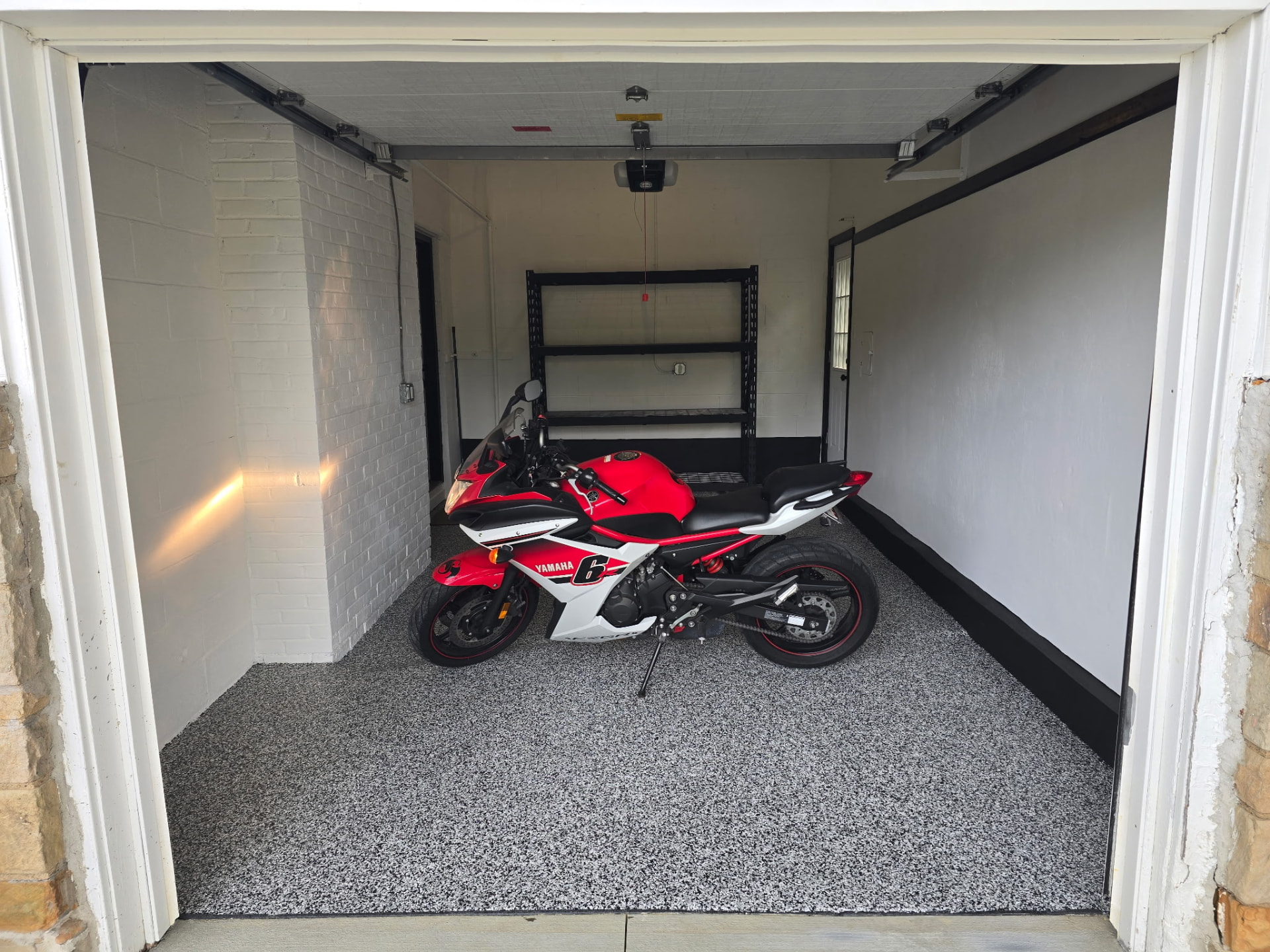 Light grey flake epoxy single-car garage floor in Stow, Ohio